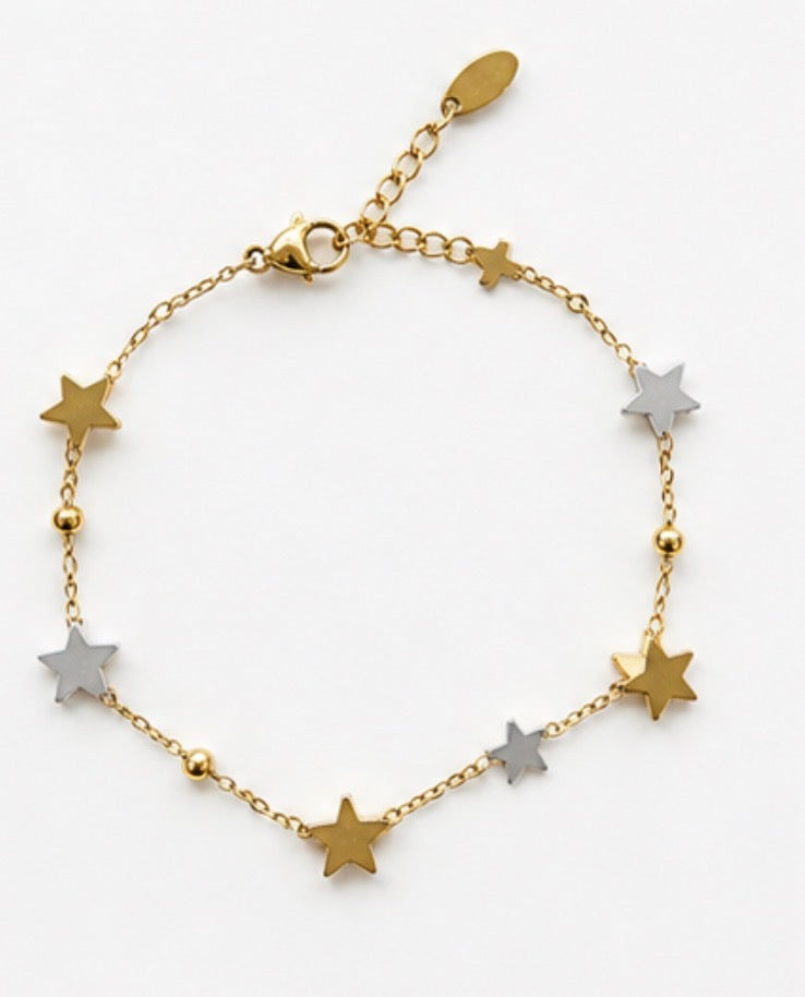 Gold and silver star charm bracelet with gold bead accents on 18k gold chain