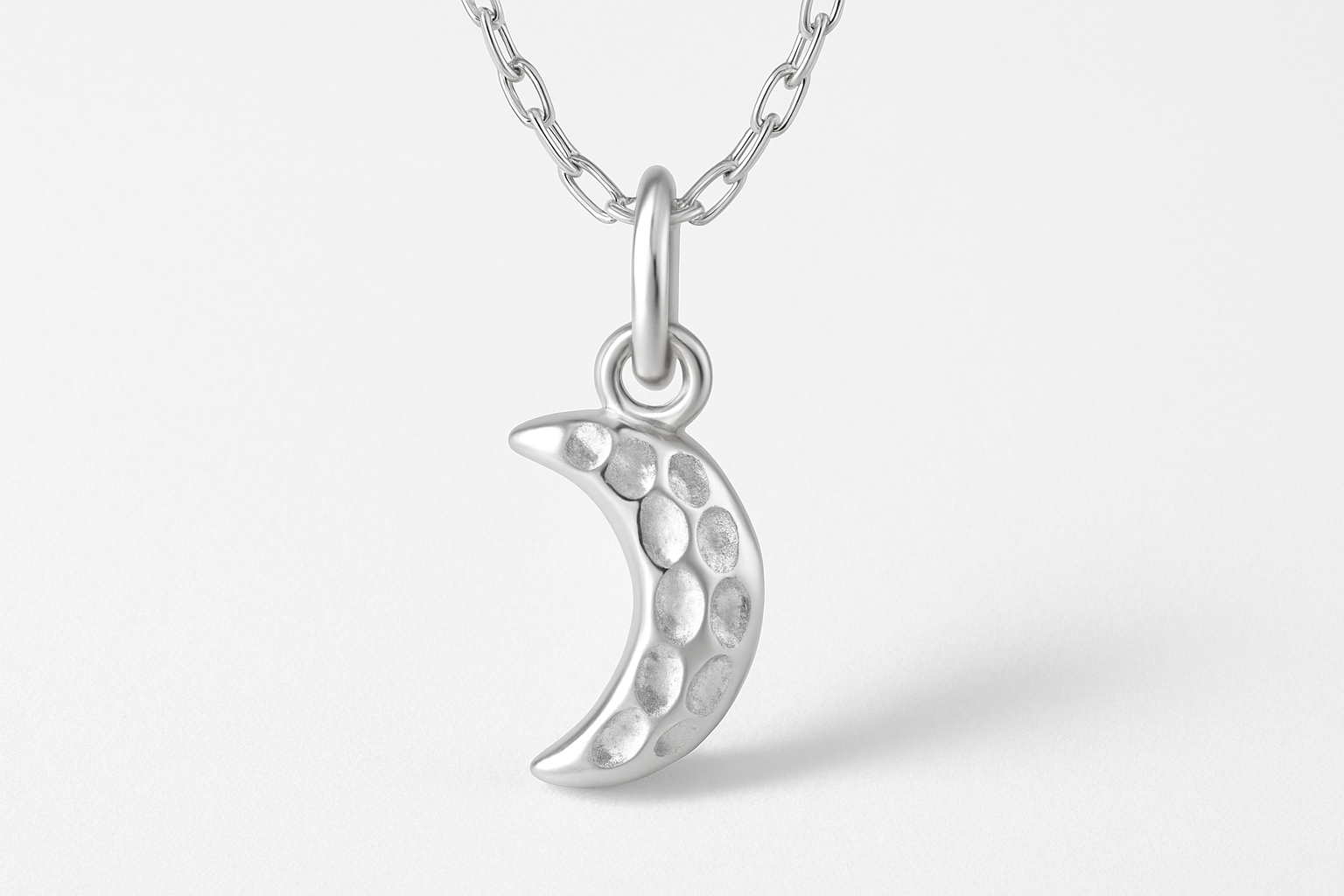 CRESCENT MOON CHARM - Sterling Silver with white backdrop