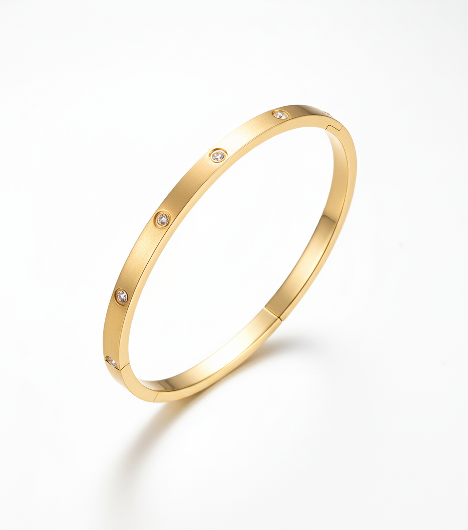 Gold bangle with studio backdrop