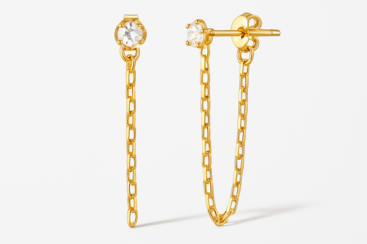 Professional studio photograph of gold diamanté chain link stud earrings