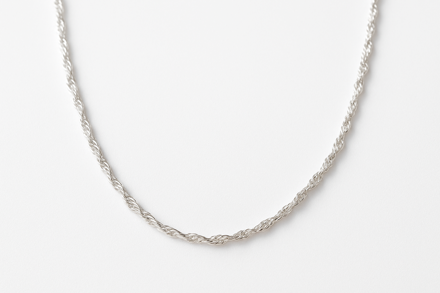 Silver Fine Chain Twist Necklace with white backdrop