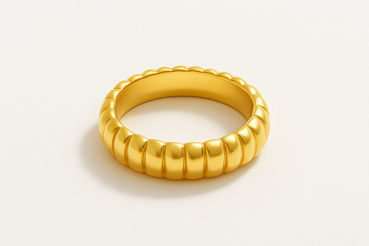 Studio flat lay image of POPPY RING - Gold with shadow