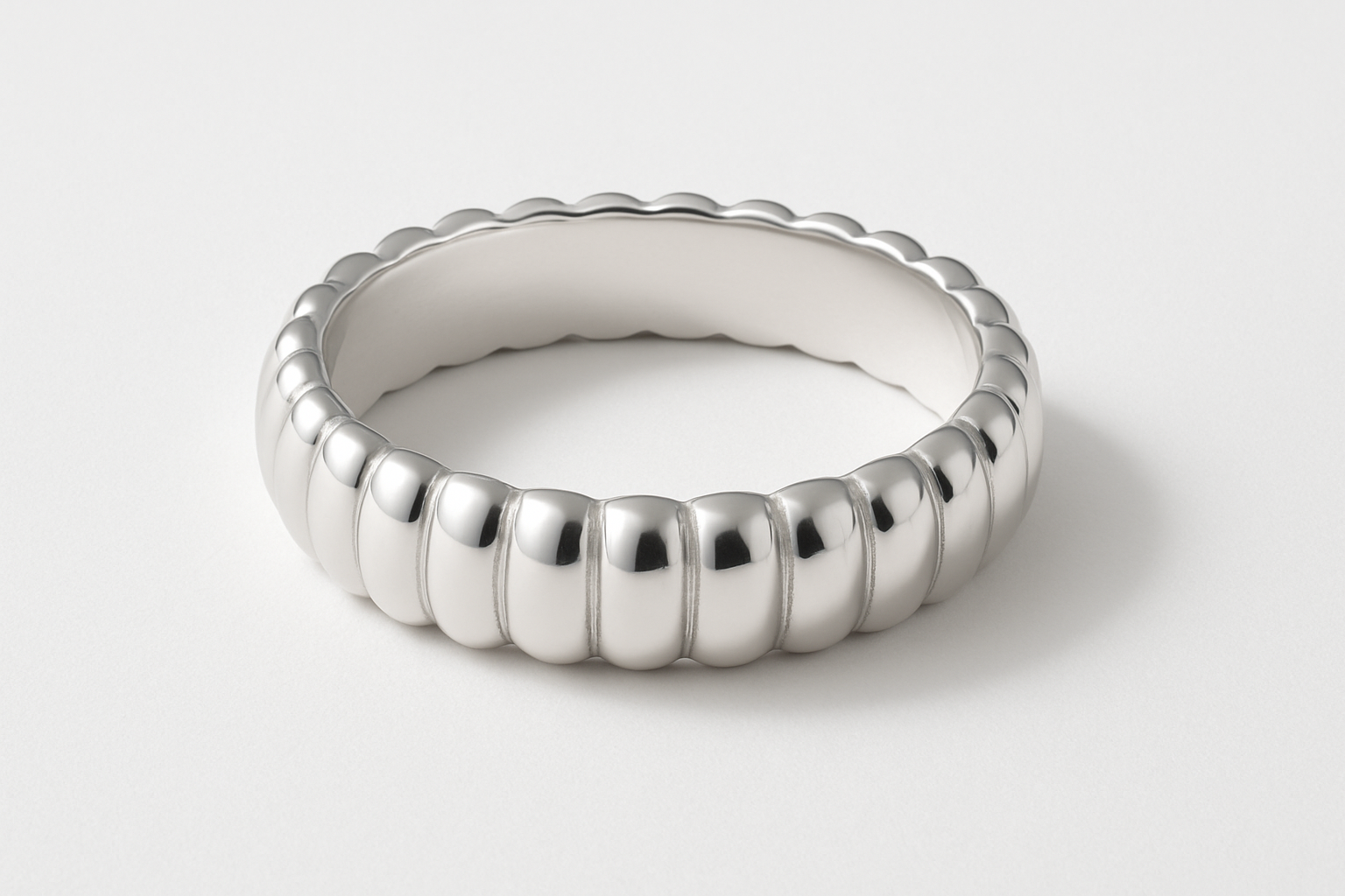 Studio flat lay image of POPPY RING - Sterling Silver with shadow