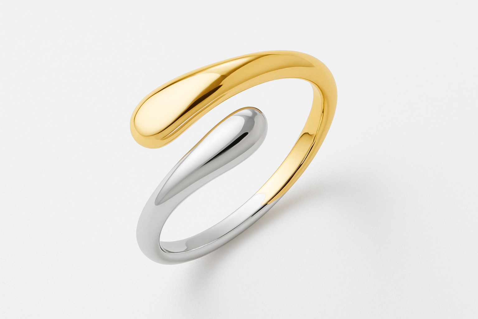 Two-tone twisted ring studio flat lay with exact design